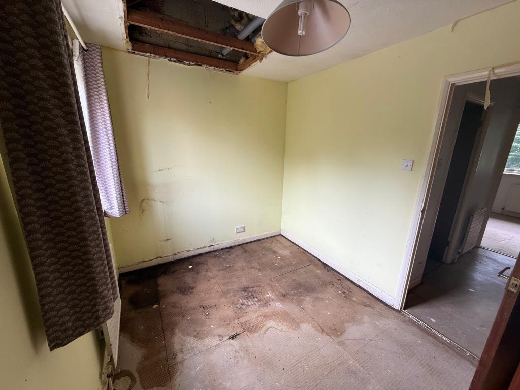 Lot: 131 - HOUSE FOR IMPROVEMENT - Front bedroom with whole in the roof